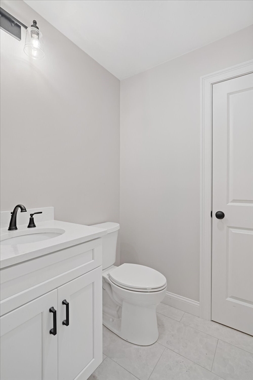 511 Mendon Road, Unit 511 Attleboro, MA 02703 - Photo 16 of 37 a bathroom with a sink a toilet and vanity