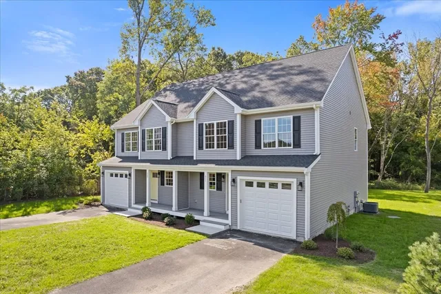 a view of a house with a yard and plants