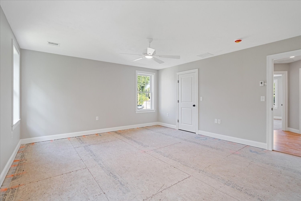 511 Mendon Road, Unit 511 Attleboro, MA 02703 - Photo 21 of 37 an empty room with windows and closet