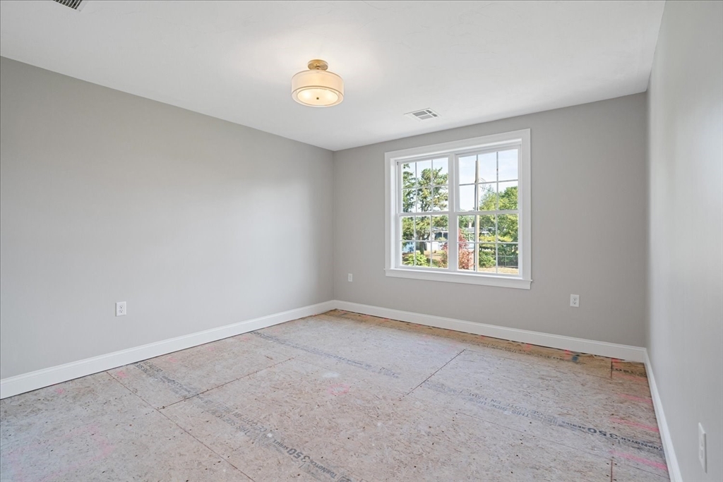 511 Mendon Road, Unit 511 Attleboro, MA 02703 - Photo 25 of 37 an empty room with windows