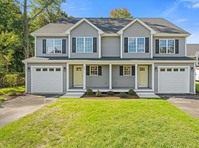 front view of a house with a yard