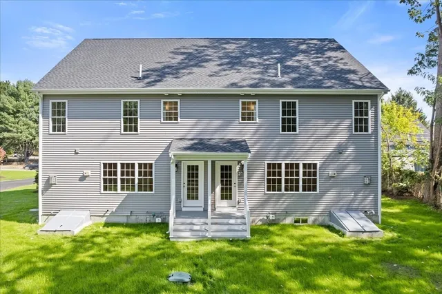 a view of a house with a yard