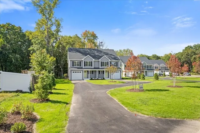 a front view of a house with a yard table and chairs