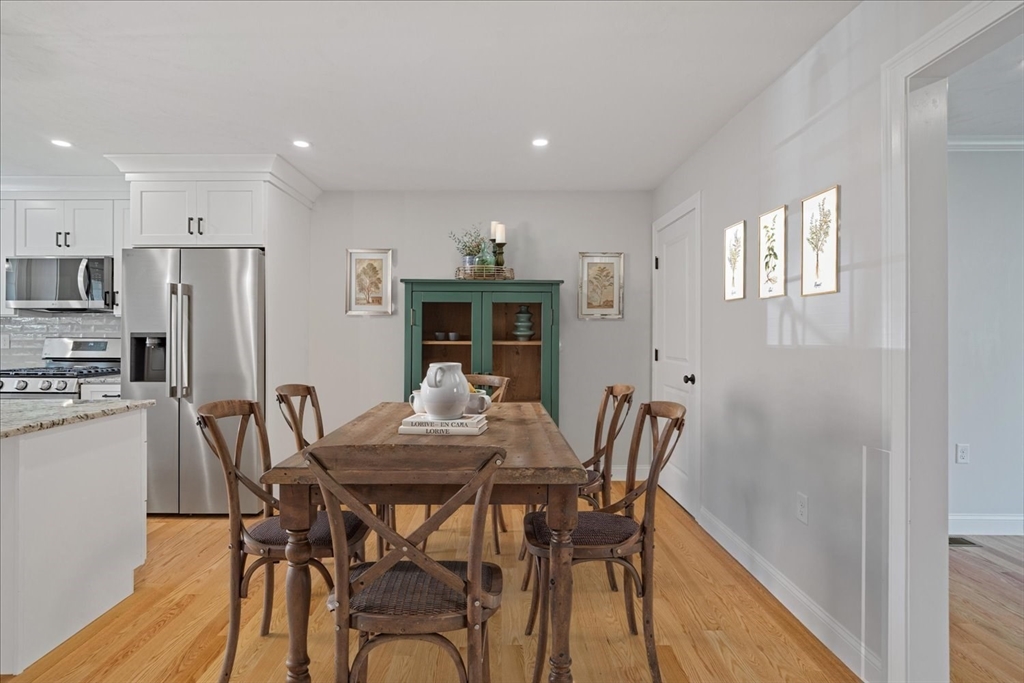 511 Mendon Road, Unit 511 Attleboro, MA 02703 - Photo 10 of 37 a view of a dining room with furniture and a refrigerator