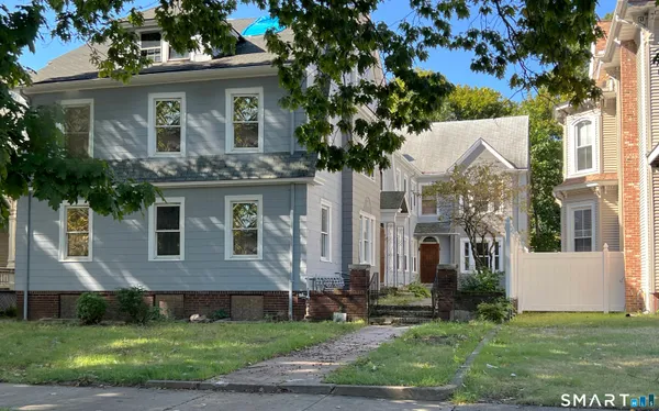 a front view of a house with a yard
