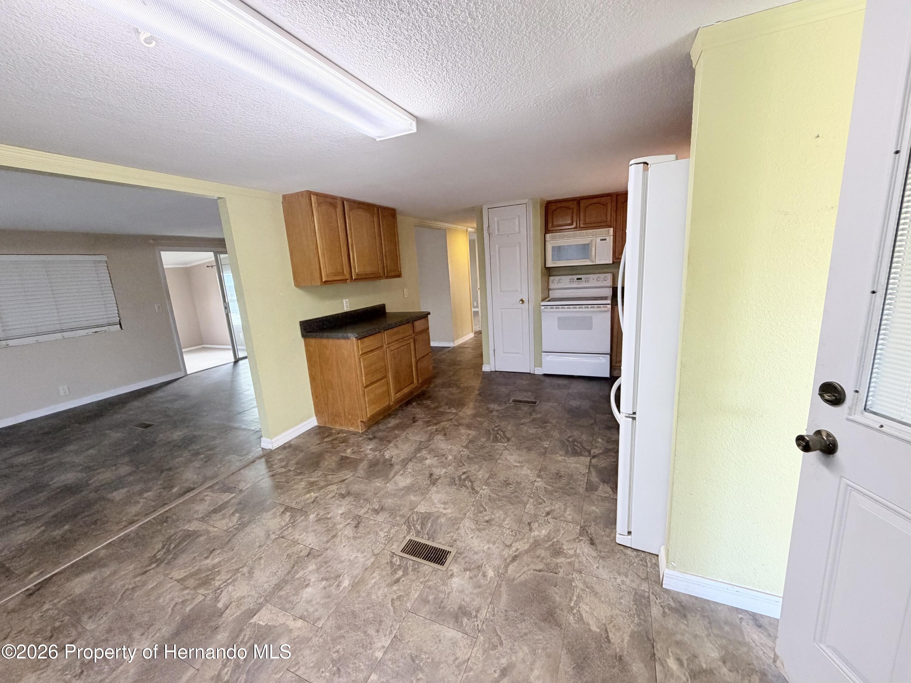 14224 Sandhurst Street Spring Hill, FL 34613 - Photo 6 of 29