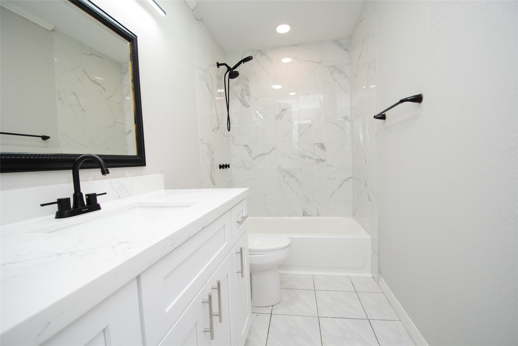 22831 John Rolfe Lane Katy, TX 77449 - Photo 26 of 34 a bathroom with a sink a toilet and shower