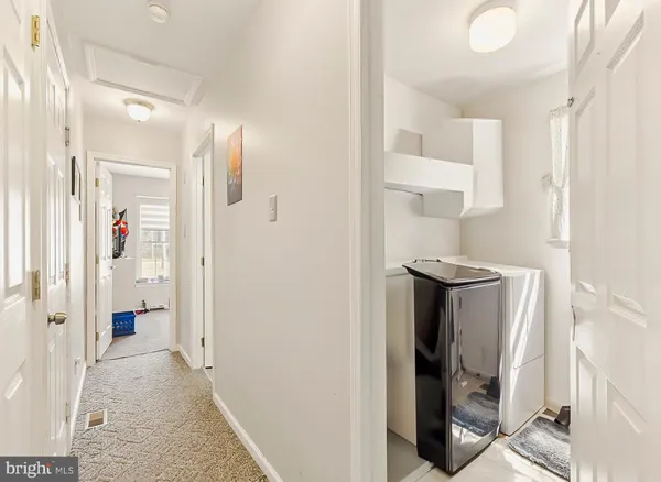 a view of a bathroom from a hallway