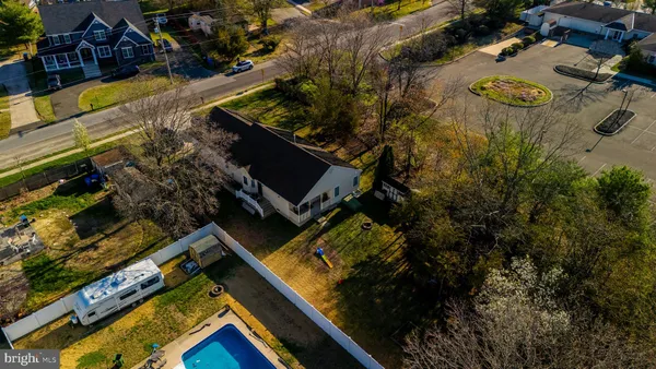 an aerial view of a house with outdoor space