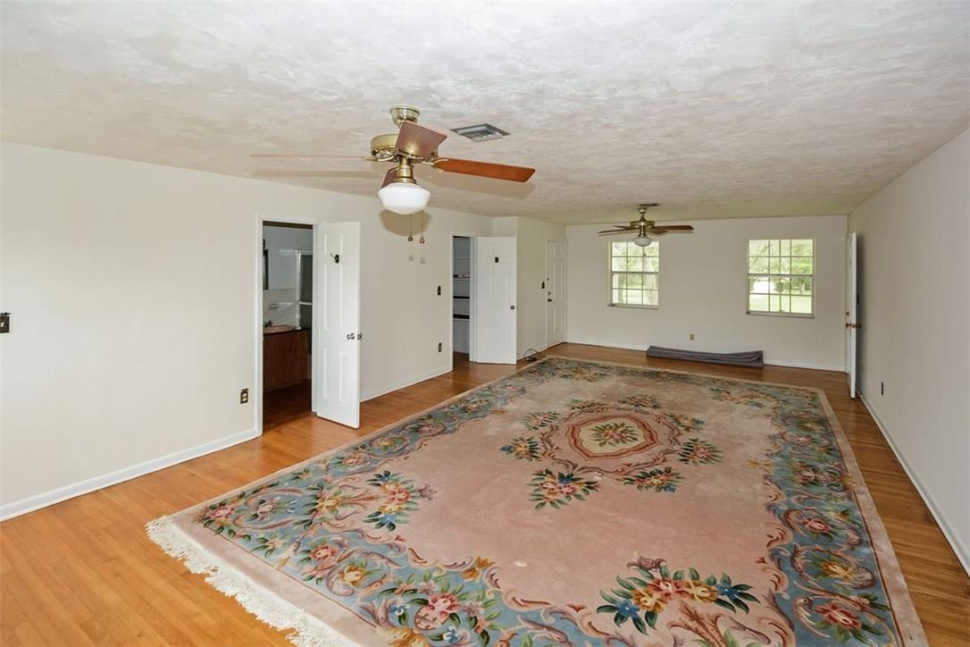 13851 Stirling Road Southwest Ranches, FL 33330 - Photo 14 of 33 wooden floor in an empty room