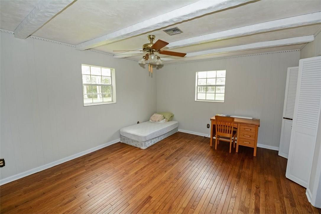 13851 Stirling Road Southwest Ranches, FL 33330 - Photo 20 of 33 a living room with furniture and a wooden floor
