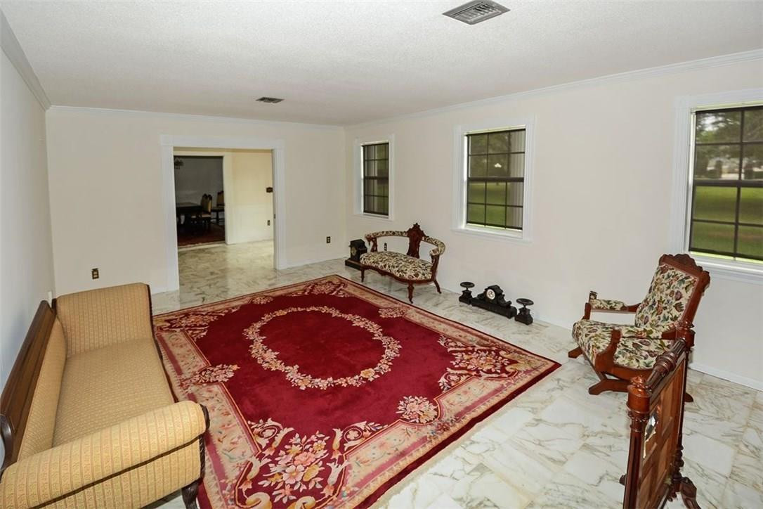 13851 Stirling Road Southwest Ranches, FL 33330 - Photo 21 of 33 a living room with furniture rug and wooden floor