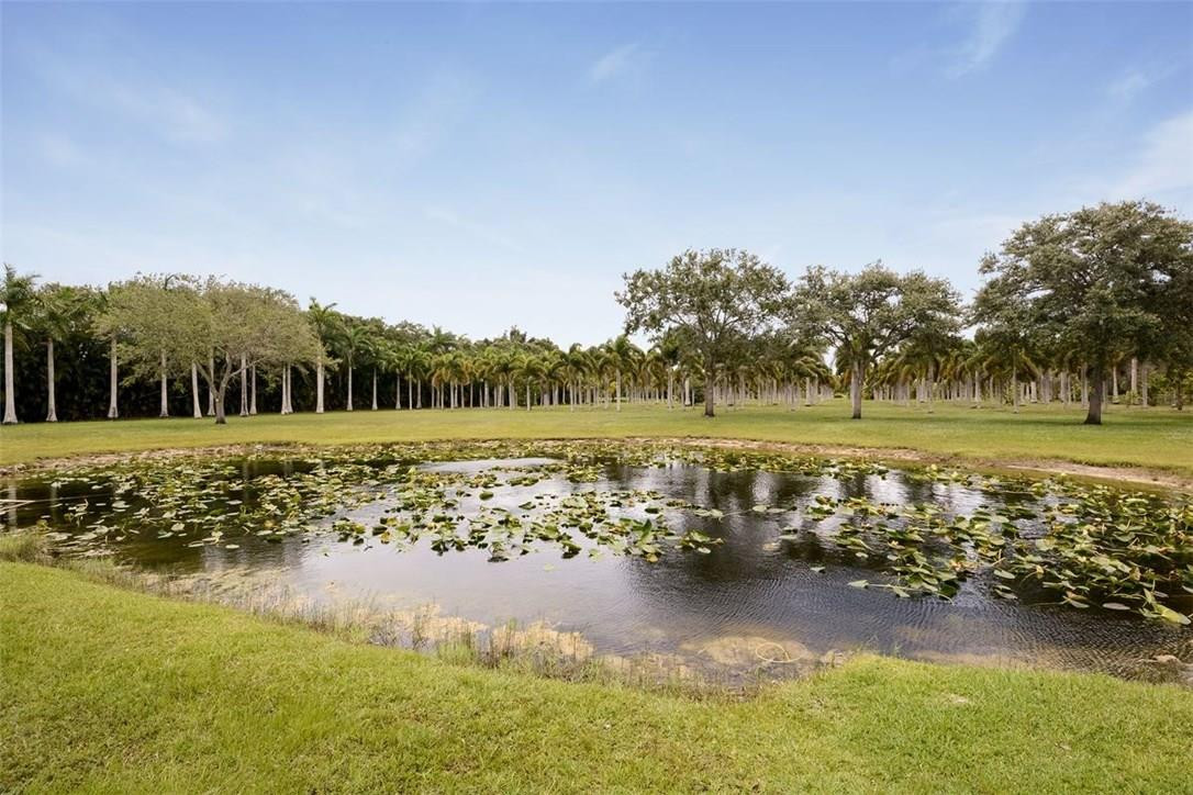 13851 Stirling Road Southwest Ranches, FL 33330 - Photo 28 of 33 a view of a lake with houses