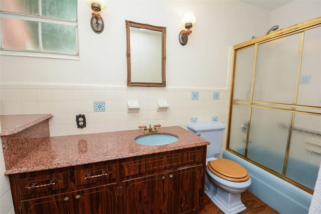 13851 Stirling Road Southwest Ranches, FL 33330 - Photo 31 of 33 a bathroom with a granite countertop sink toilet and shower