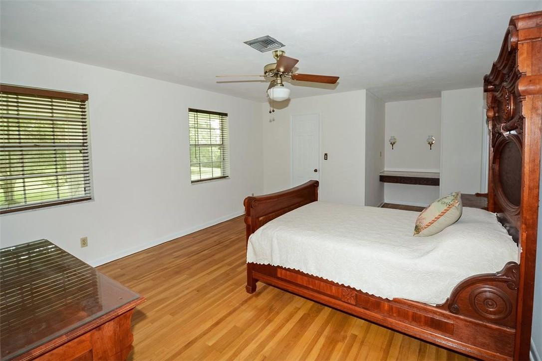 13851 Stirling Road Southwest Ranches, FL 33330 - Photo 32 of 33 a bedroom with a bed and window