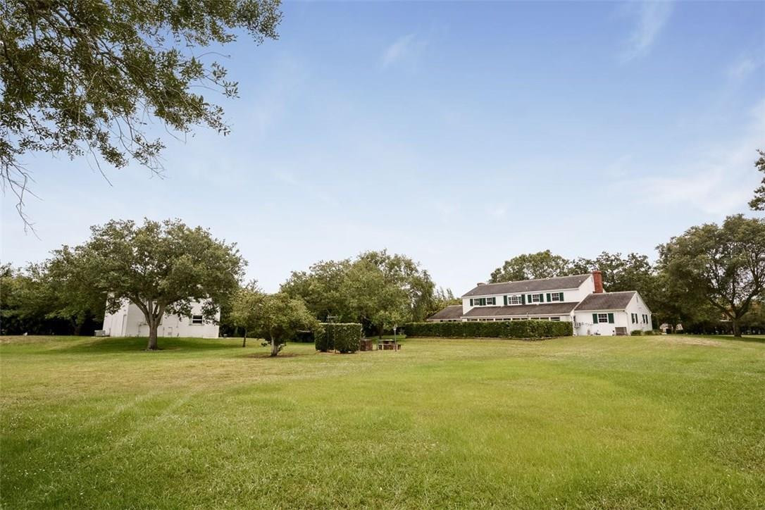13851 Stirling Road Southwest Ranches, FL 33330 - Photo 6 of 33 a view of yard with swimming pool and trees