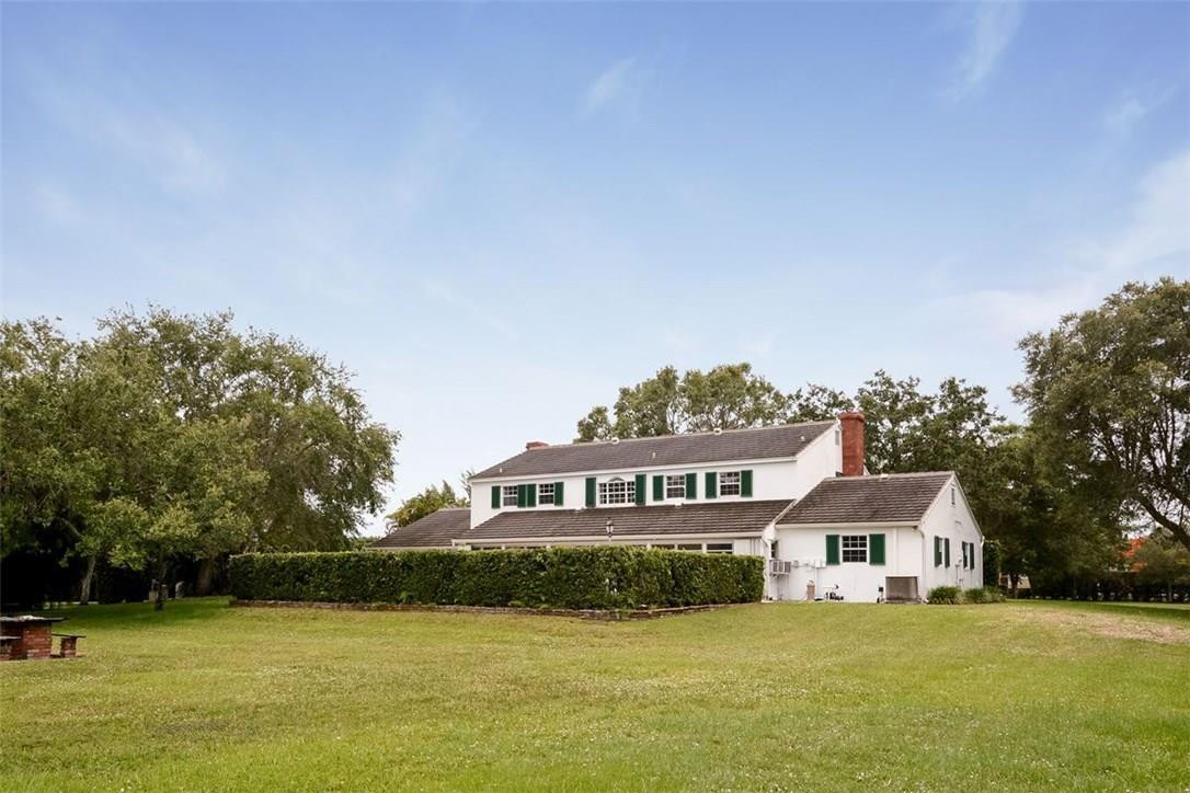 13851 Stirling Road Southwest Ranches, FL 33330 - Photo 7 of 33 a front view of a house with a yard
