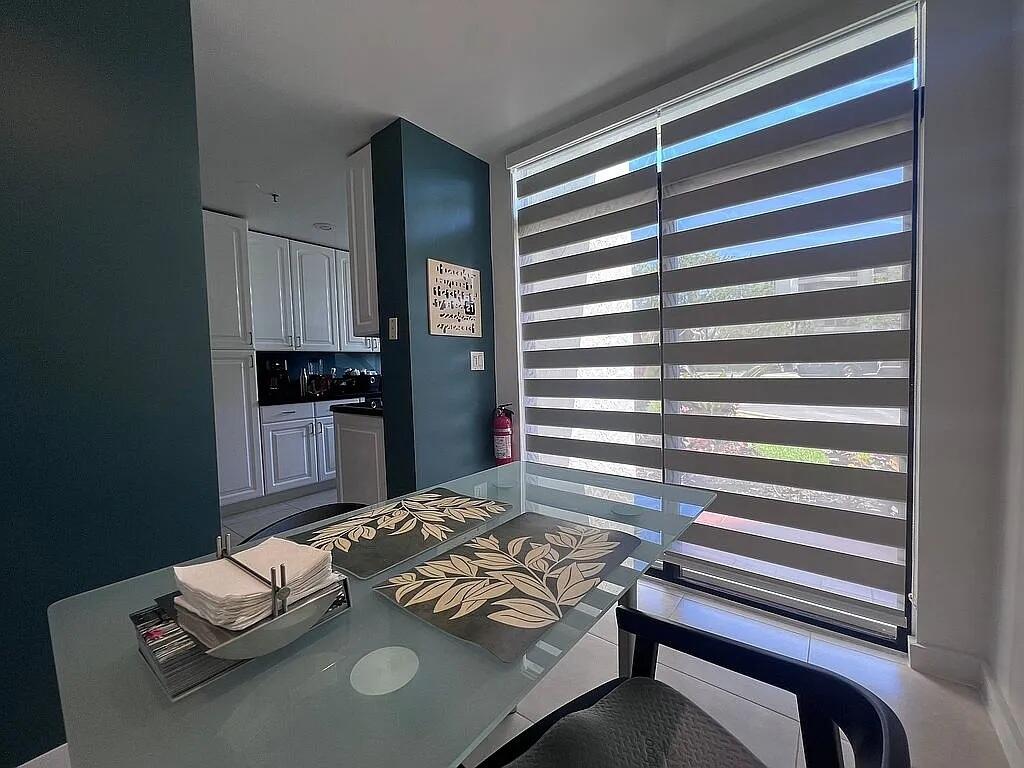 6463 La Costa Drive, Unit 105 Boca Raton, FL 33433 - Photo 6 of 40 a living room with furniture and a window