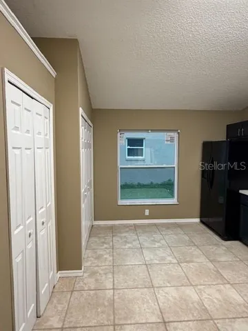 a view of a livingroom with kitchen area