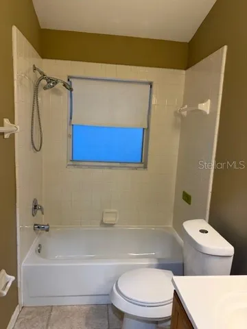 a picture of a bathroom with a shower
