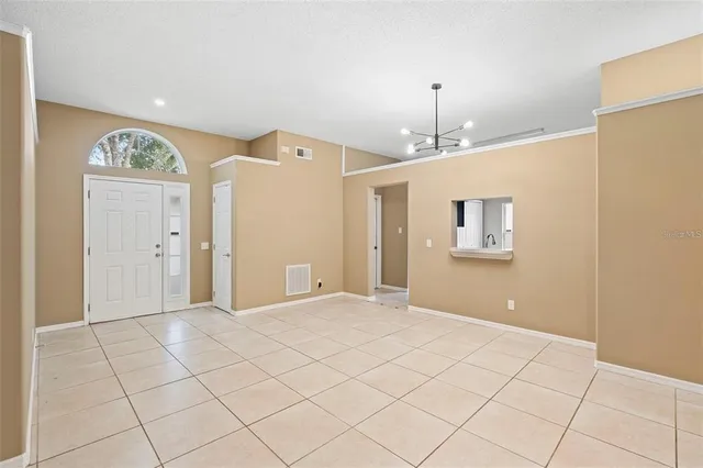 a view of an empty room and window