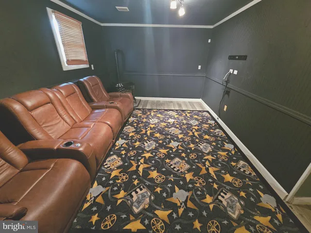 a blue bed sitting in a bedroom next to a window