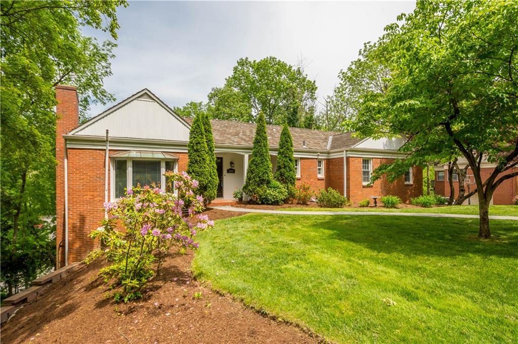 front view of a house with a yard