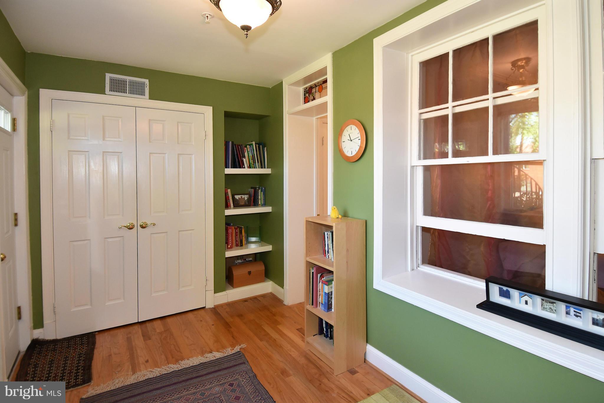 4010 Kansas Avenue Northwest, Unit 1 Washington, DC 20011 - Photo 16 of 28 a view of an entryway with wooden floor and cabinet