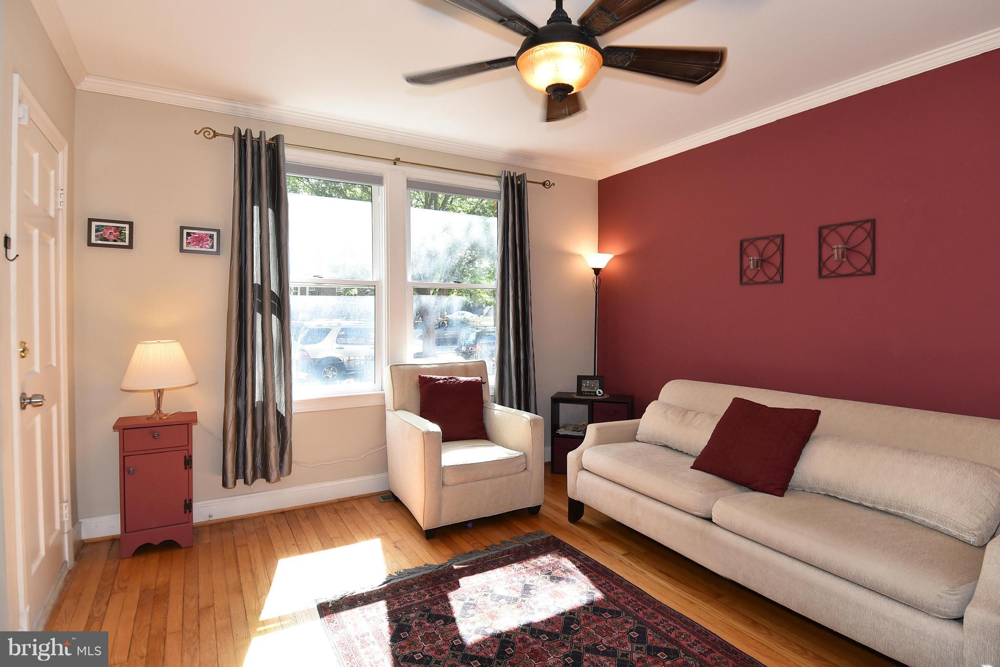 4010 Kansas Avenue Northwest, Unit 1 Washington, DC 20011 - Photo 3 of 28 a living room with furniture and a window