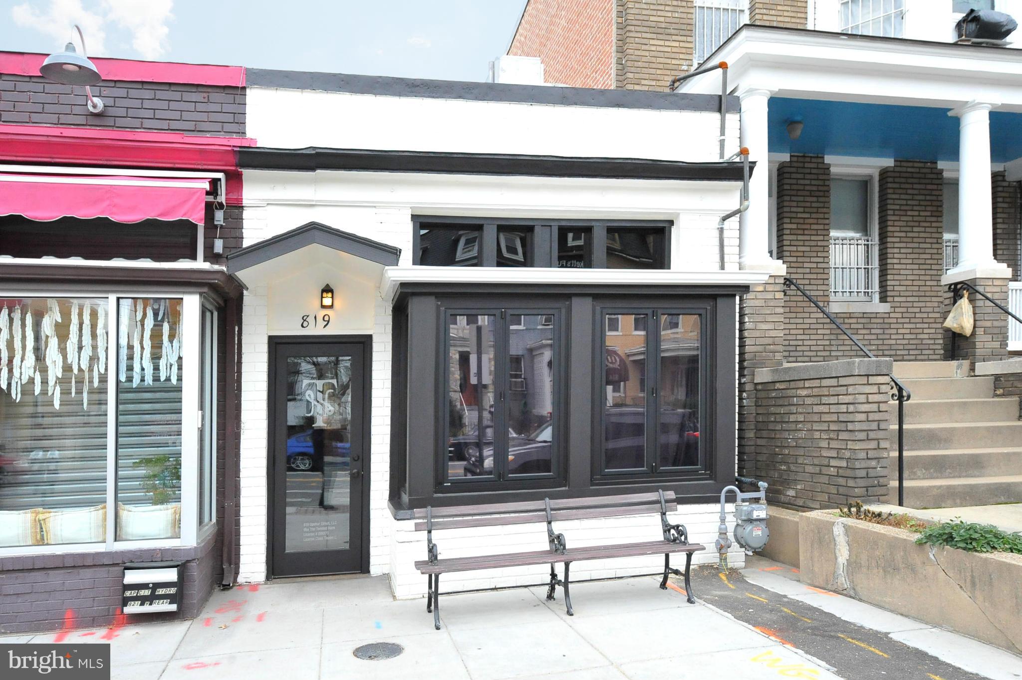 4010 Kansas Avenue Northwest, Unit 1 Washington, DC 20011 - Photo 26 of 28 a bench in front of building