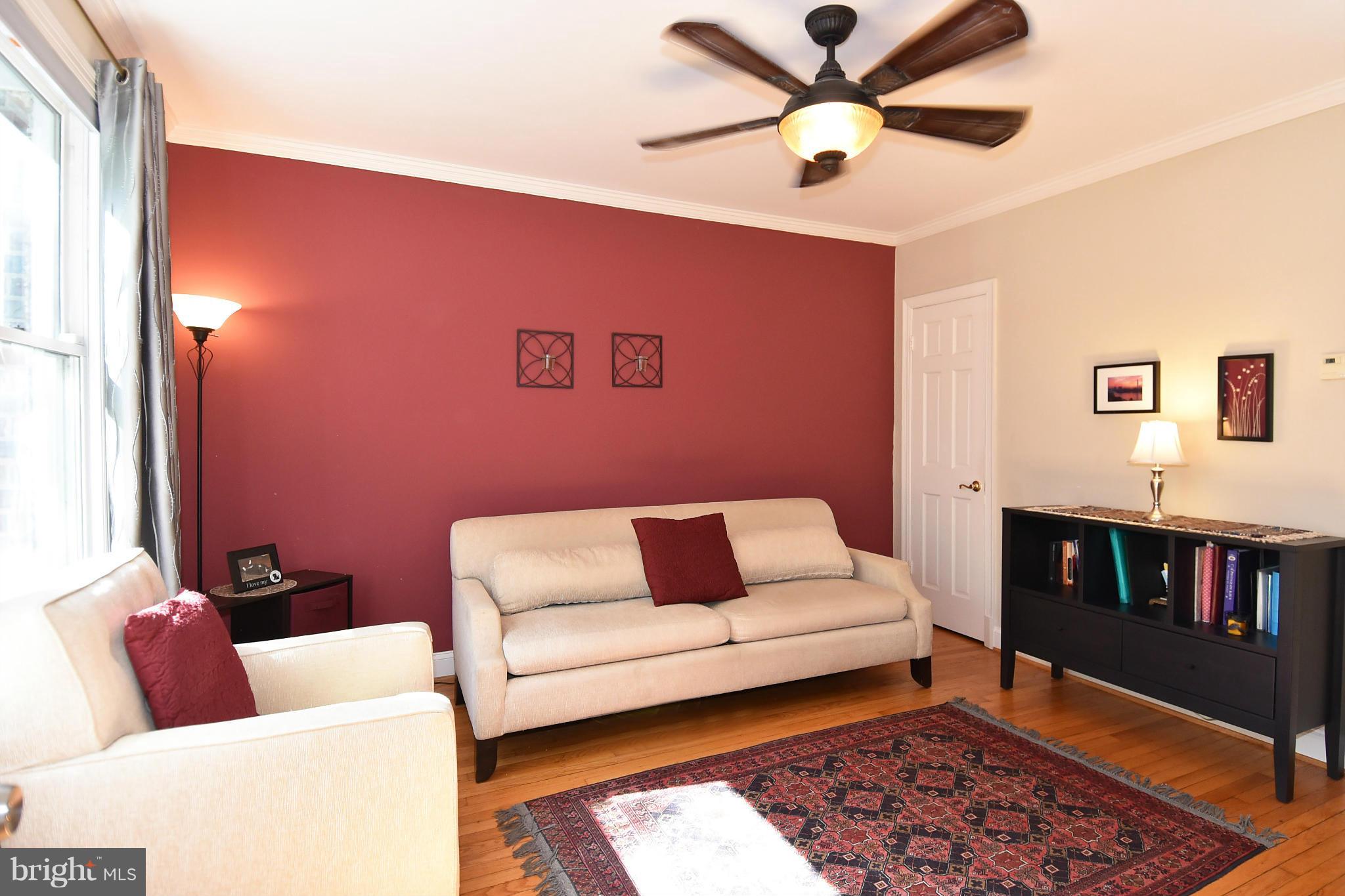 4010 Kansas Avenue Northwest, Unit 1 Washington, DC 20011 - Photo 4 of 28 a living room with furniture and a rug