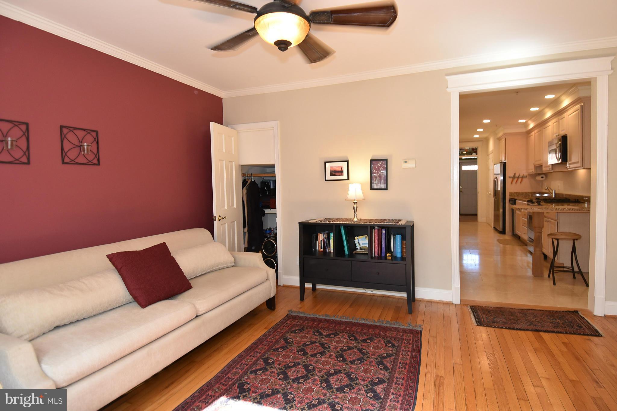 4010 Kansas Avenue Northwest, Unit 1 Washington, DC 20011 - Photo 5 of 28 a living room with furniture and a rug