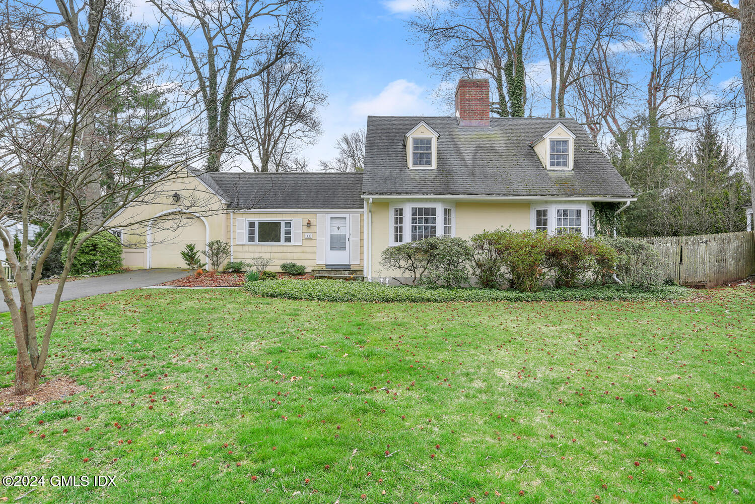 11 Field Road Riverside, CT 06878 - Photo 2 of 14 a front view of house with yard and green space