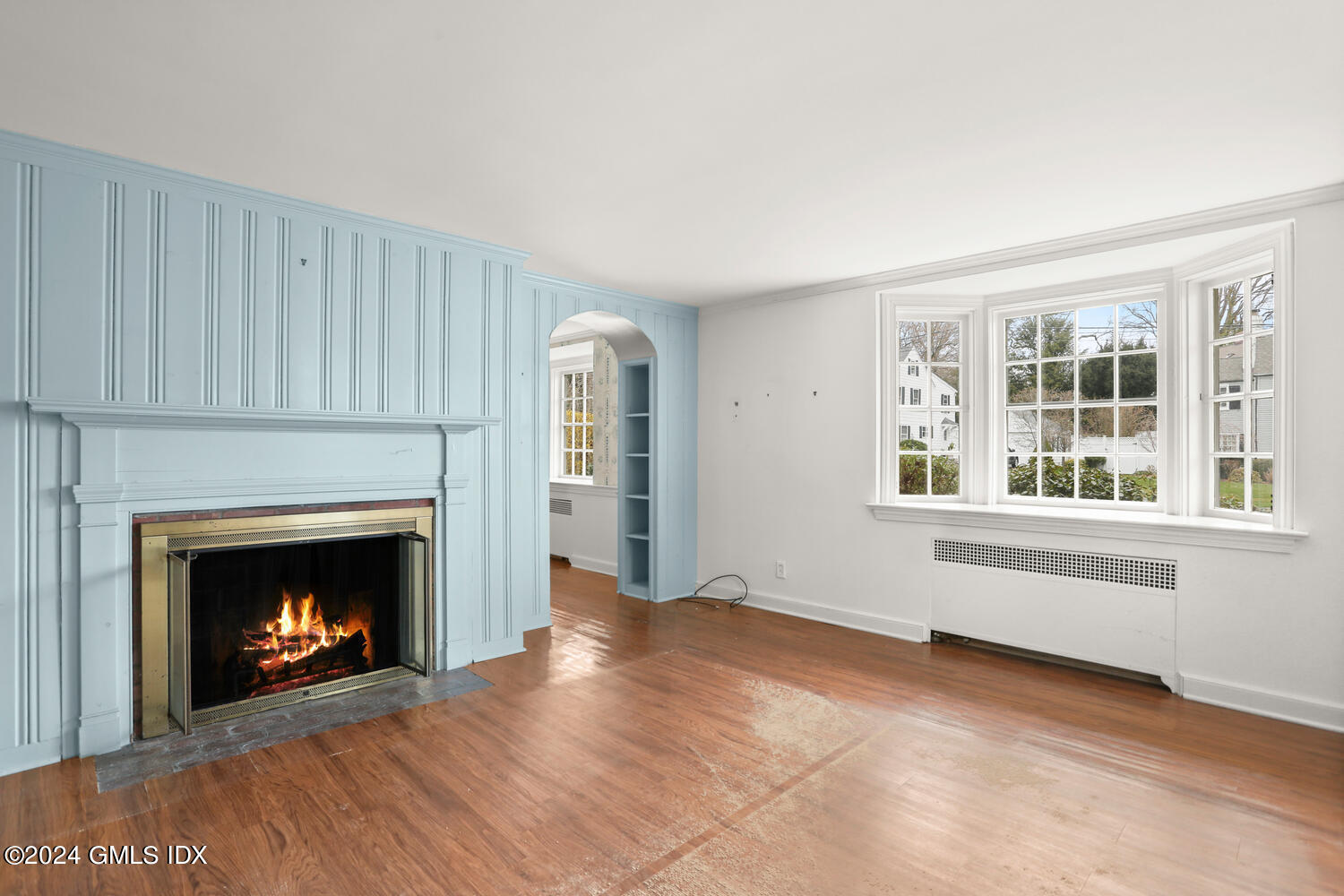 11 Field Road Riverside, CT 06878 - Photo 6 of 14 a view of an empty room with window and fireplace