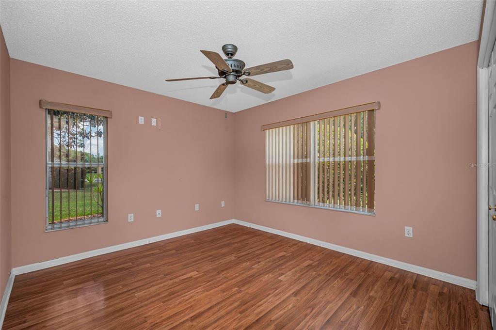 11917 Hadleigh Way Trinity, FL 34655 - Photo 35 of 84 a view of an empty room with wooden floor and a window