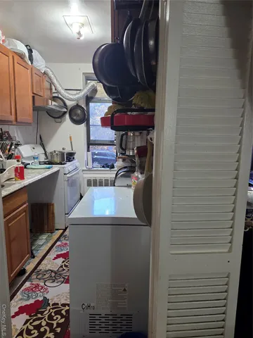 a kitchen with stainless steel appliances granite countertop a sink and a stove