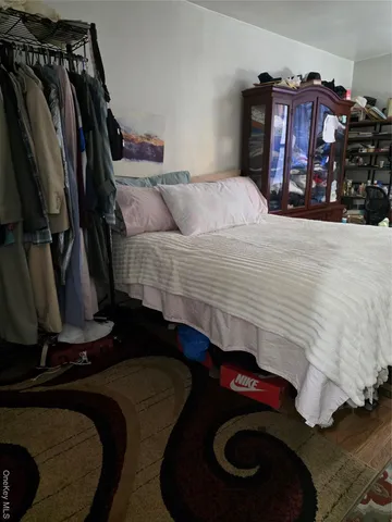 a bedroom with a bed and closet