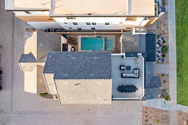 5367 Cyan Lane St. George, UT 84790 - Photo 15 of 49 Aerial perspective showcasing a property with multiple rooflines and an outdoor entertaining area