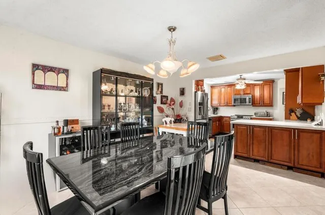 a view of a dining room with furniture and window