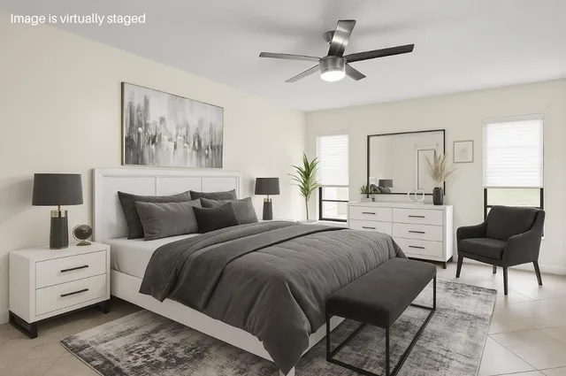 a bedroom with a bed and a couch