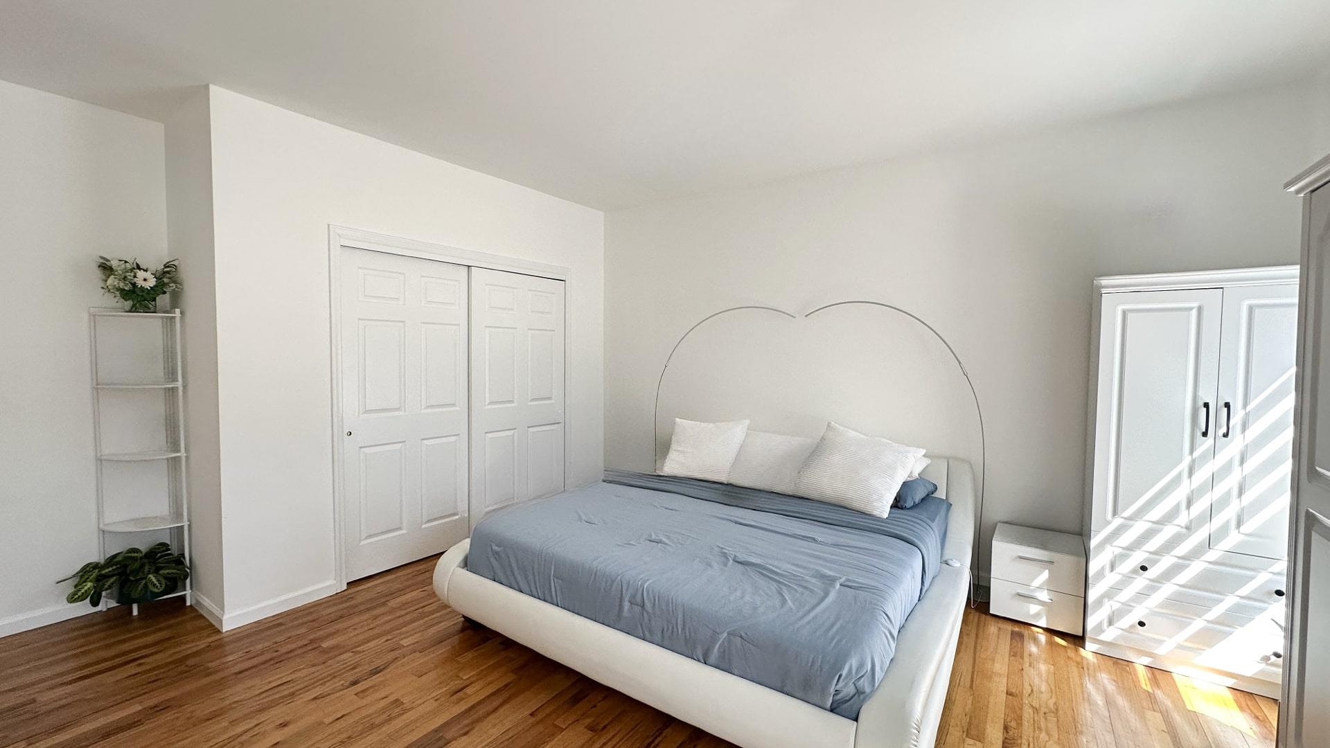 39 Washington Avenue East Hampton, NY 11937 - Photo 15 of 21 Bedroom featuring baseboards, a closet, and light wood-style floors