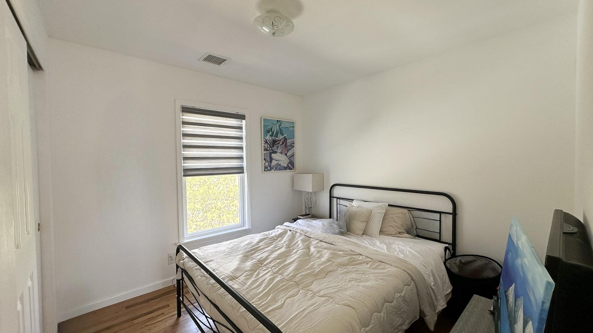 39 Washington Avenue East Hampton, NY 11937 - Photo 17 of 21 Bedroom featuring baseboards, visible vents, and wood finished floors