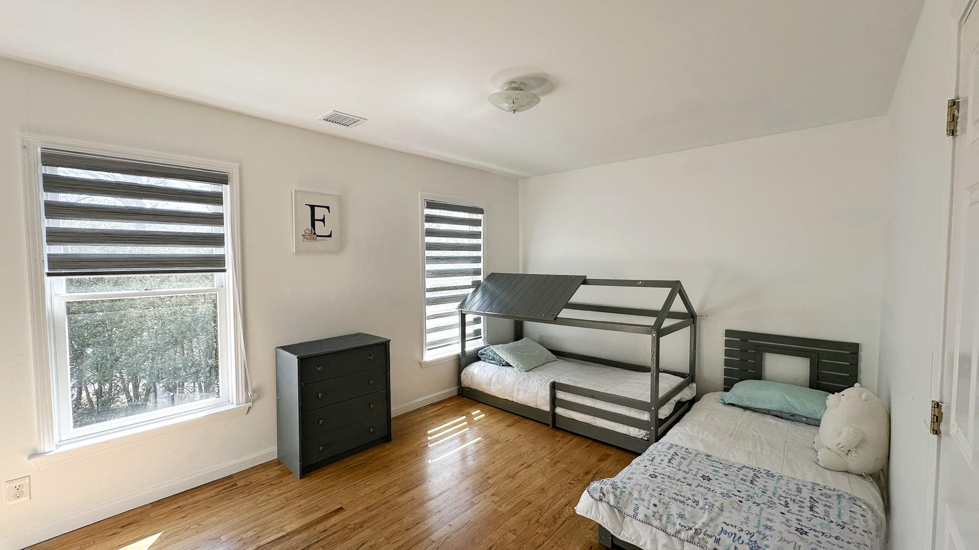 39 Washington Avenue East Hampton, NY 11937 - Photo 18 of 21 Bedroom with wood finished floors, baseboards, and visible vents