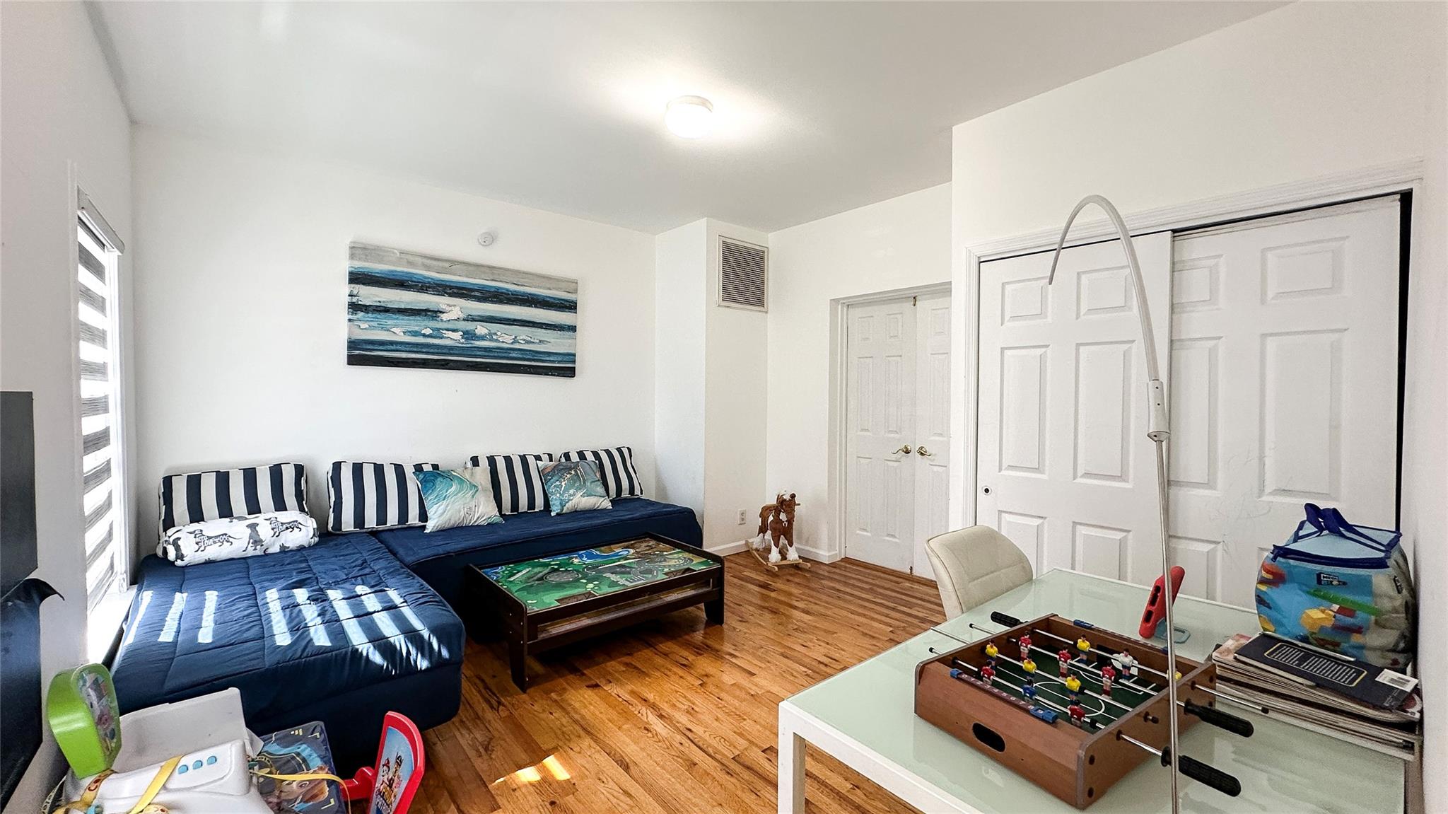 39 Washington Avenue East Hampton, NY 11937 - Photo 20 of 21 Living area featuring visible vents and wood finished floors