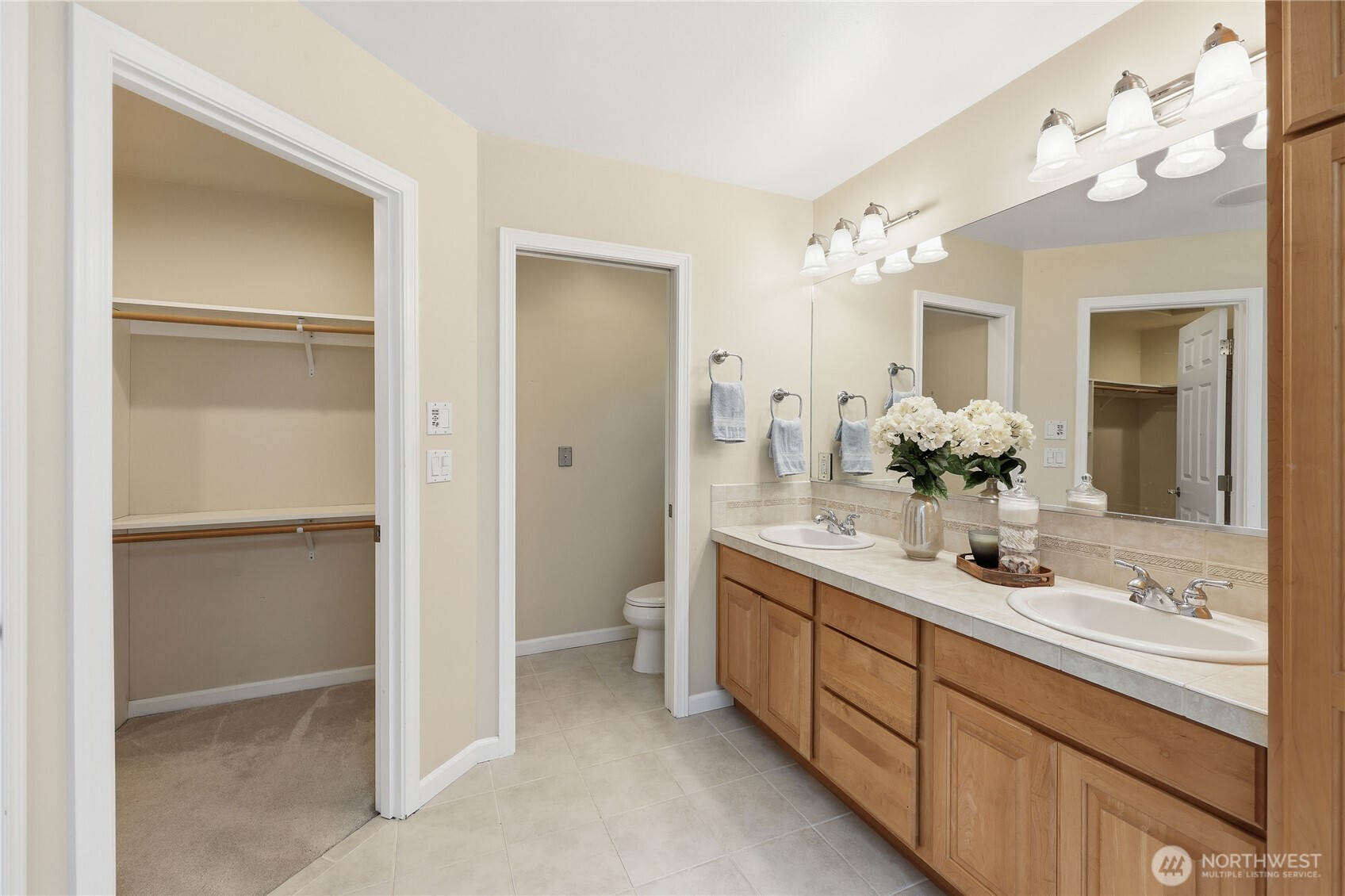 4354 Northwest Westgate Road Silverdale, WA 98383 - Photo 24 of 40 a bathroom with a double vanity sink mirror and next to a white cabinet