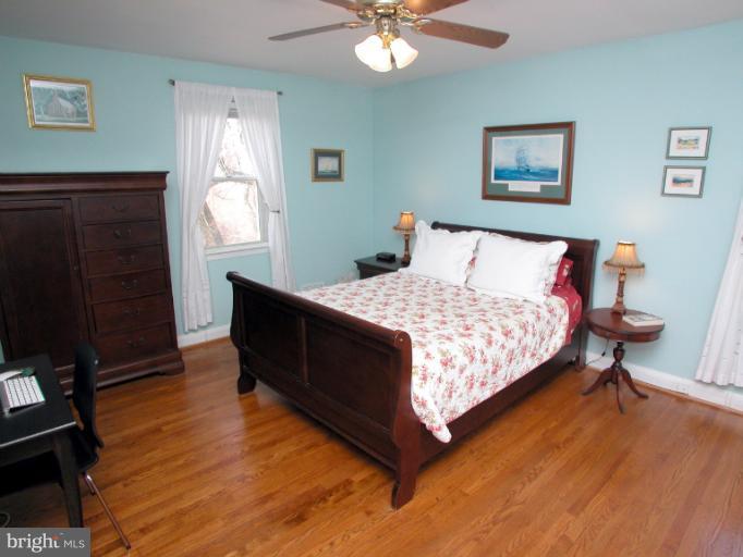 222 Gaywood Road Baltimore, MD 21212 - Photo 12 of 24 a bed sitting in a bedroom next to a window