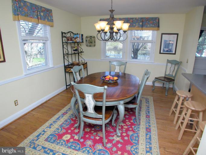 222 Gaywood Road Baltimore, MD 21212 - Photo 14 of 24 a view of a dining room with furniture and chandelier