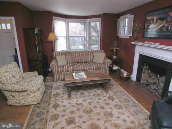 222 Gaywood Road Baltimore, MD 21212 - Photo 17 of 24 a living room with furniture and a fireplace