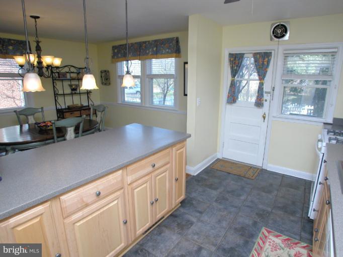 222 Gaywood Road Baltimore, MD 21212 - Photo 18 of 24 a kitchen with cabinets and window