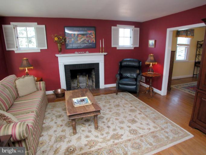 222 Gaywood Road Baltimore, MD 21212 - Photo 4 of 24 a living room with furniture and a fireplace